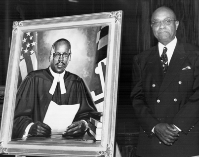 Artist Simmie Knox with portrait of Judge Cole
