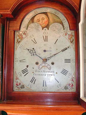 Detail of face of tall case clock by John Fessler