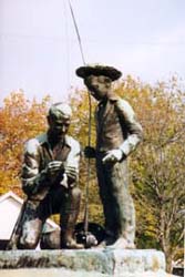 [photo, Fisherman and Boy statue, outside former Town Offices, 10 Frederick Road, Thurmont, Maryland]