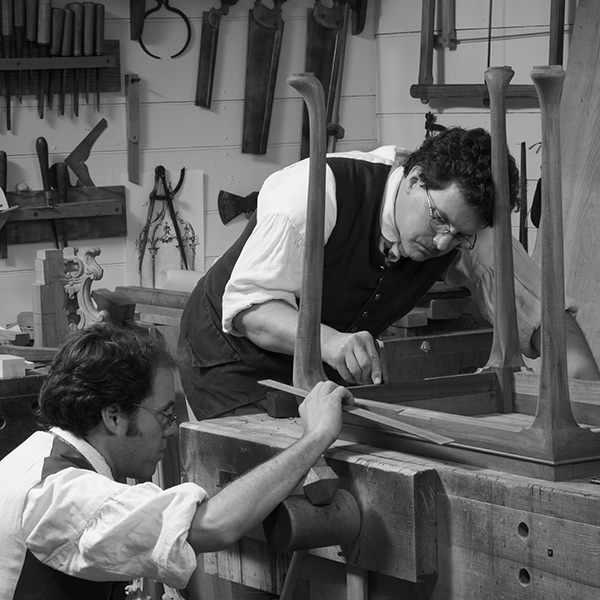 Apprentice cabinetmakers Francis Pavlak and Brian Weldy work in the Anthony Hay Cabinetmaker's Shop