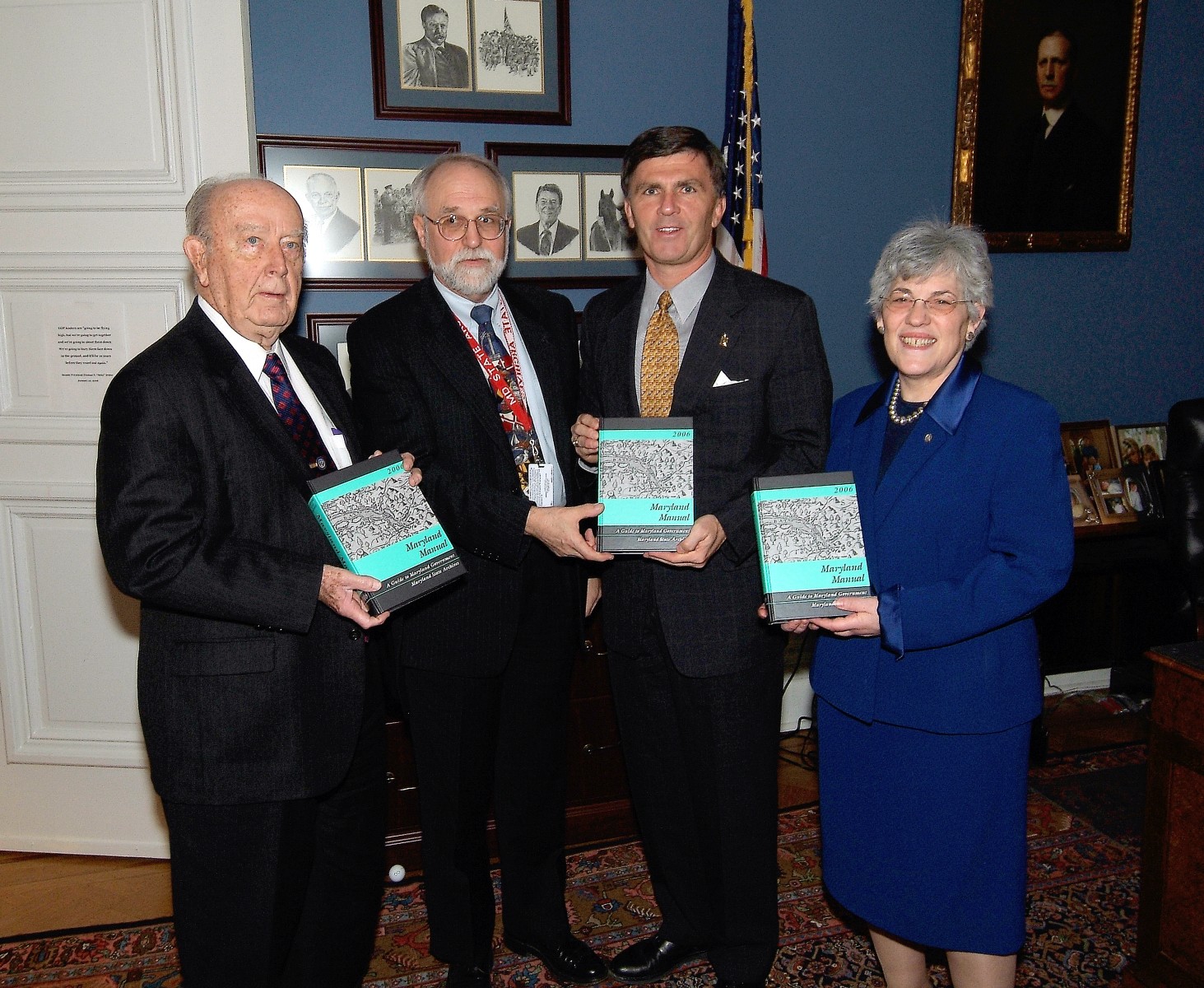 State Archivist Edward C. Papenfuse delivers Manual to Comptroller Schaefer, Governor Ehrlich and Treasurer Kopp
