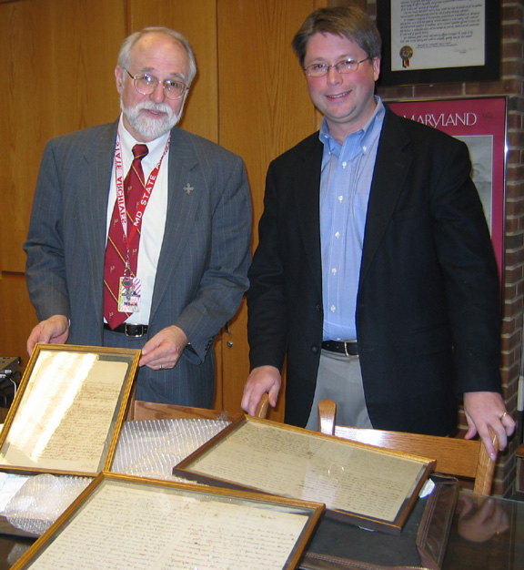 Ed Papenfuse and David Troy, president of Friends of the Archives, examining the documents upon arrival