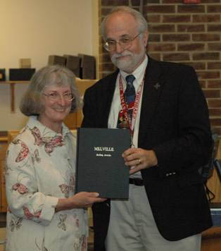 Dr. Papenfuse presents Pat Melville with a bound copy of Bulldog articles: Photo by Jenn Foltz Cruickshank