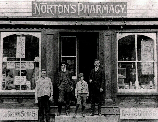 nortons pharmacy, proprietors stand in front