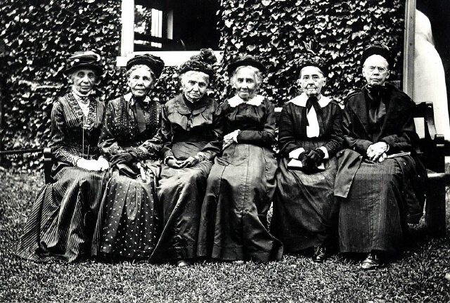image shows quaker women sitting in a row