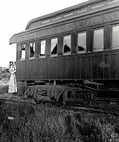 emma sadler standing on railroad car step at love point