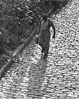 Man walking on cobblestones